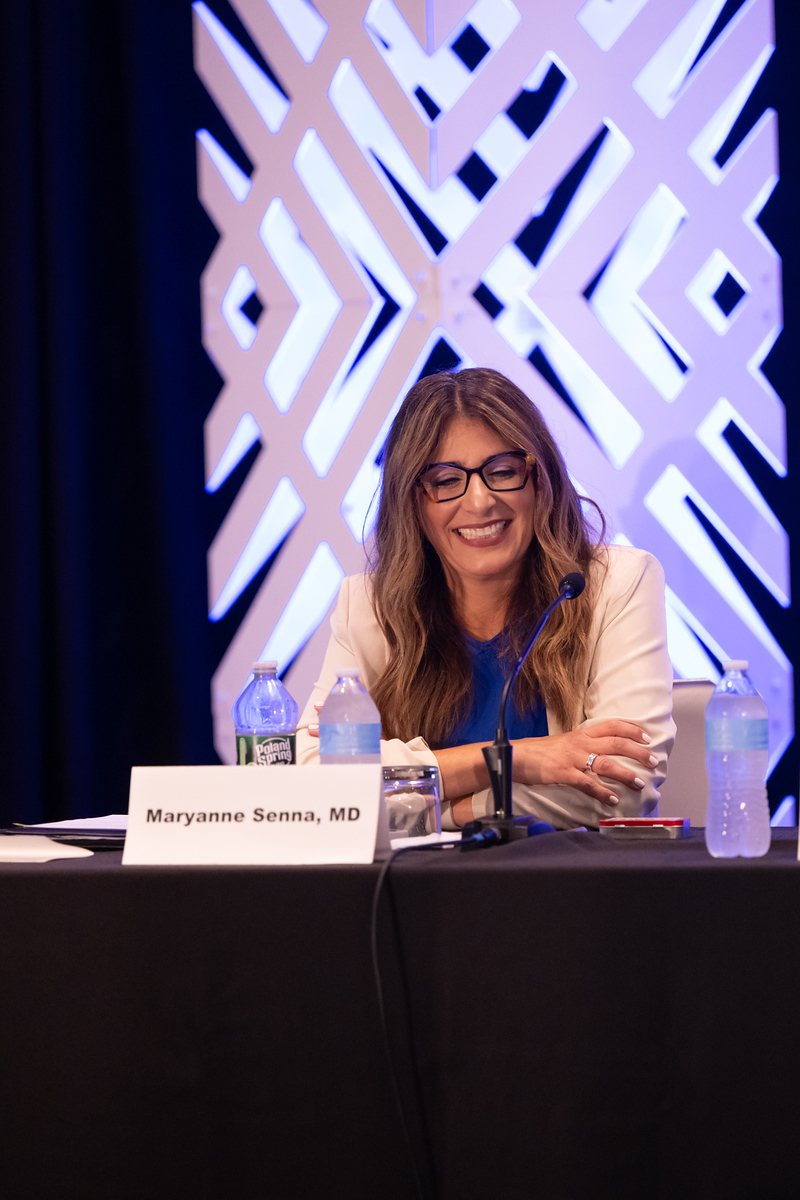 Dr. Senna seated at the panel table at the 2026 Hair Health Summit